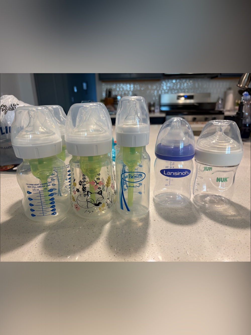 Assorted Baby Feeding Bottles - Clear with Green and Blue Accents